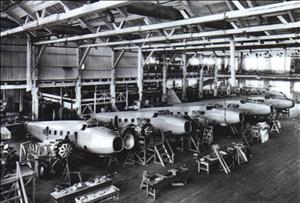A group of airplanes in a hangar 